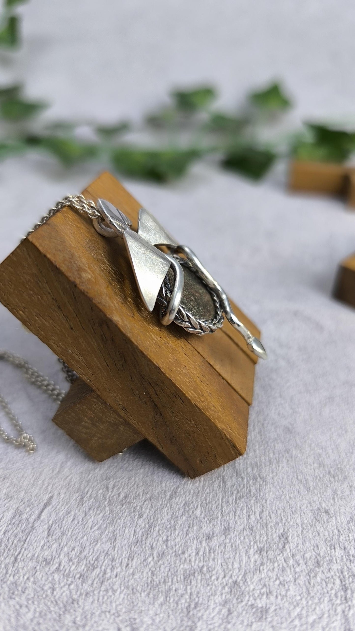 Dragon carrying an authentic roman coin