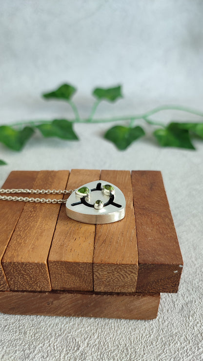 Kinetic Pendant with moving Peridot gemstones - "Sliding Gems"