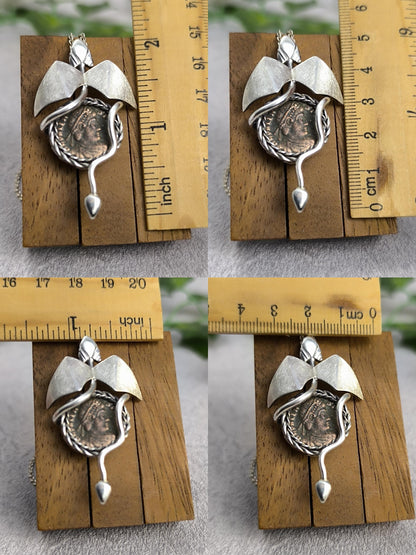 Dragon carrying an authentic roman coin